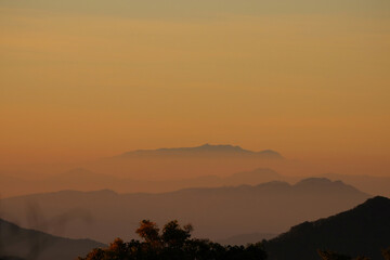 Misty morning sunrise and mountain landscape beautiful place