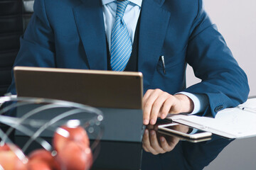 man typing at computer