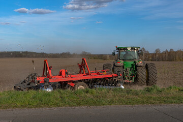 Fototapeta premium plowing the land with machinery