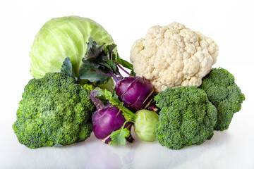 Cabbage on isolated background. Different kinds of cabbage: white cabbage, cauliflower, broccoli,...