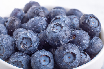 Fresh ripe blueberries with drops of dew. Berry background. Macro photo - Image