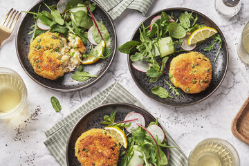 Smoked mackerel fishcakes served with a rocket, spinach salad