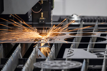 The fiber laser cutting machine cutting  machine cut the metal plate. The hi-technology sheet metal manufacturing process by laser cutting machine. - obrazy, fototapety, plakaty