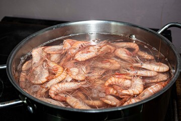 fresh shrimps boiling  in a  pot