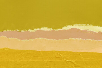 Colorful torn paper collage close-up. Texture made from various paper and cardboard parts. Damaged...