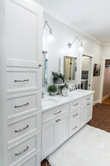 Fototapeta na wymiar Large white renovated master bathroom with red brick floors