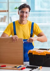 Furniture carpenter working in the workshop