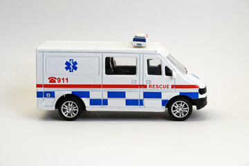 toy car medical rescue service close up on white background, copy space