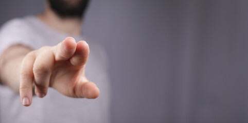 Naklejka premium young man finger pointing touch modern