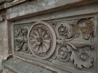Stucco on the old manor building. Fretwork on the castle. Beautiful refined element of the exterior.