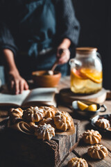 Woman cooks in a vintage kitchen on wooden tablet. Healthy drink, Eco, vegan.