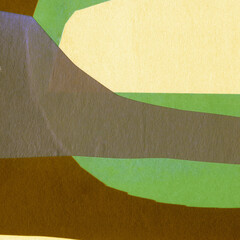 Green torn paper collage close-up. Texture made from various paper and cardboard parts. Damaged old paper background. Vintage blank wallpaper. Material design backdrop.