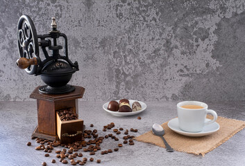 Vintage manual coffee grinder with coffee beans 
