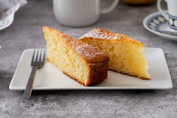 Lemon pound cake on rustic wooden background with lemon