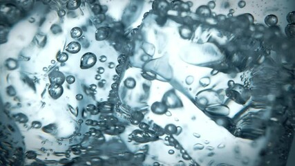 Close up slow motion stacked ice cubes collapsing with bubbles under water. - Powered by Adobe