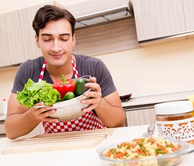 Man male cook preparing food in kitchen
