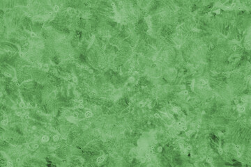 Green ink and watercolor texture on white paper background. Paint leaks and decalcomania effects. Hand-painted gouache abstract image. Mess on the canvas.