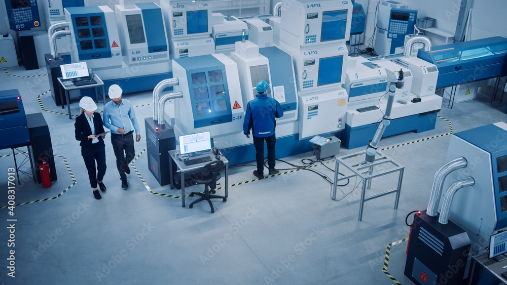 Poster industry four factory: female executive and chief engineer inspect facility workshop, look at robot 