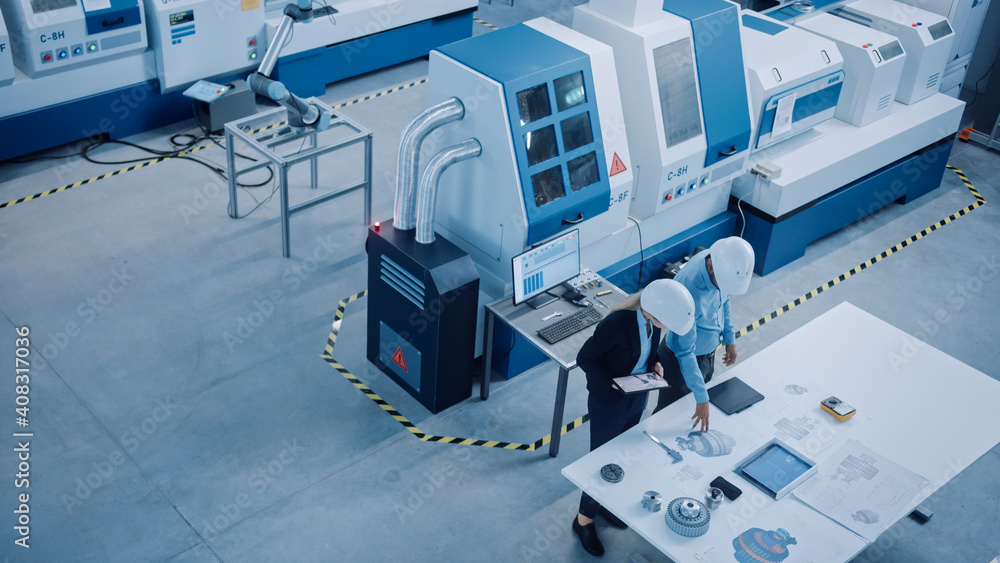 Poster industry four factory: female executive and chief engineer inspect facility workshop, look at robot 