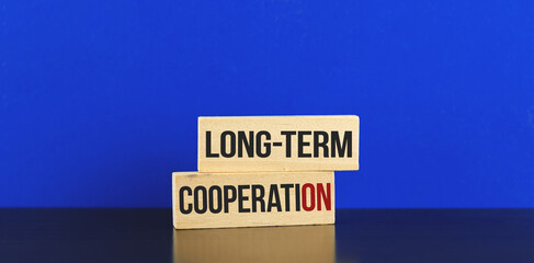 Long-term cooperation conceptual image for businessman and freelancer maded with wooden pegs
