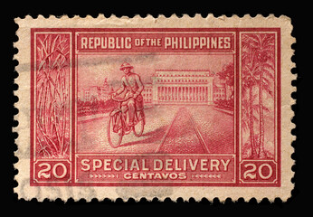 Stamp printed in Philippines shows Courier and Post office, circa 1947