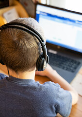 Boy working on computer for school