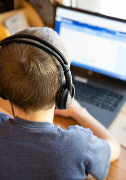 Boy working on computer for school