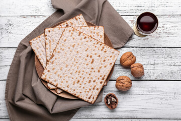 Composition with Jewish flatbread matza for Passover on wooden background