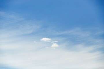 Small fluffy cloud on cirrocumulus clouds background - obrazy, fototapety, plakaty