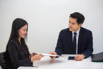 Portrait of Start-up Asia business team in meeting and helped analyze the marketing problems of the company or beginning new project. Start up concept