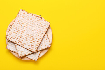 Plate with Jewish flatbread matza for Passover on color background