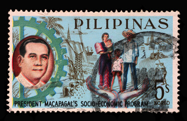 Stamp printed in Philippines shows President Macapagal and Filipino family, Series 5-year Socioeconomic Program, circa 1963.