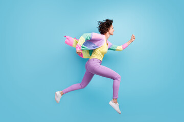 Fototapeta na wymiar Photo portrait profile full body view of running woman isolated on pastel blue colored background
