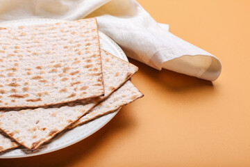 Plate with Jewish flatbread matza for Passover on color background, closeup
