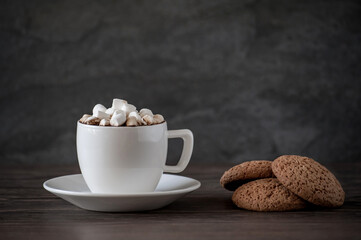 cup of coffee with marshmallows and oatmeal cookies