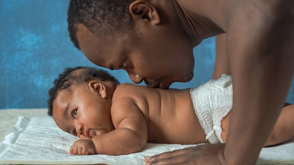 African man with his little baby