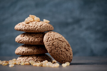 a stack of oatmeal cookies on a wooden table