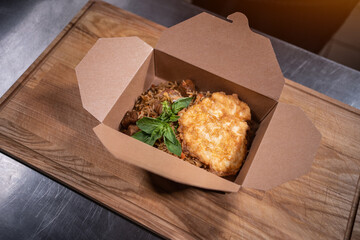 closeup of food in cardboard container for delivery