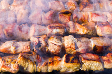 Georgian traditional dish, Mtsvadi on the fire, raw meal on the grill, barbeque