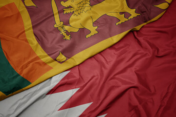 waving colorful flag of bahrain and national flag of sri lanka.