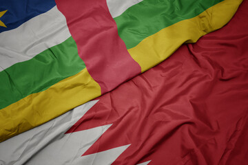 waving colorful flag of bahrain and national flag of central african republic.