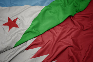 waving colorful flag of bahrain and national flag of djibouti.