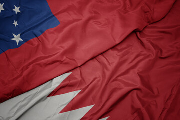 waving colorful flag of bahrain and national flag of Samoa .