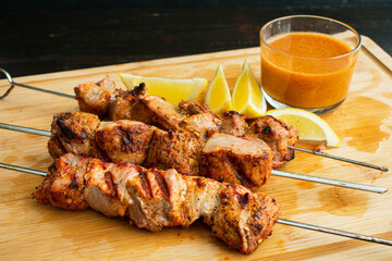 Pinchos Morunos - Spanish Pork Kebabs: Marinated chunks of pork tenderloin grilled on skewers and serves with paprika aioli and lemon wedges