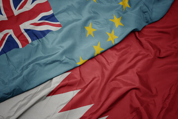 waving colorful flag of bahrain and national flag of Tuvalu .