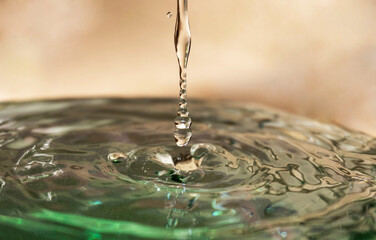 water drop falling into water