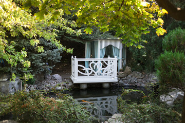 The ninth alcove with a white bridge in the park.