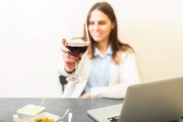 person drinking wine sitting in her apartment