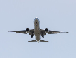 The Gray passenger plane in the sky