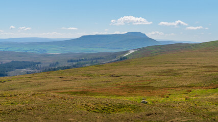 Fototapeta premium A cloudy day in the Yorkshire Dales with Pen-Y-Ghent in the background near Oughtershaw, North Yorkshire, England, UK